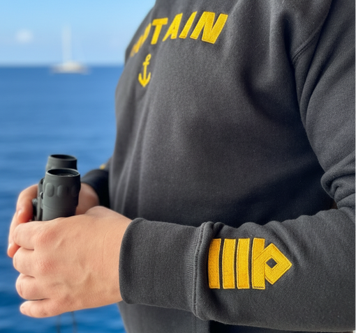 Merchant navy officer in professional maritime uniform with gold rank insignia epaulettes